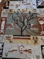 Full view of Ege wool shag rug showing tree of life design and borders