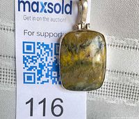 Front view of rectangular bumblebee jasper pendant in sterling silver setting