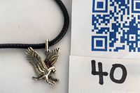 Sterling silver eagle pendant on black cord