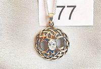 Front view of sterling silver Celtic Tree of Life pendant on chain showing oval CZ and knot design