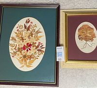 Both framed dried flower pictures side by side
