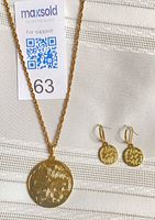 Set showing pendant necklace and earrings together