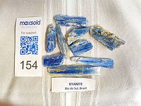 Nine blue kyanite crystal pieces displayed with label and size reference