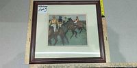front view of framed Degas equestrian print with ruler for scale