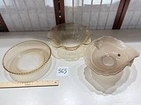 Three pressed glass bowls displayed together