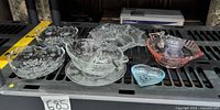 All pressed glass items displayed on shelf