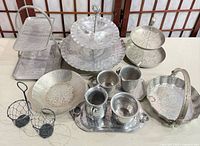 All 12 mixed metal serving pieces displayed together
