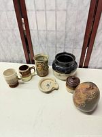 Full group view of all seven stoneware pieces