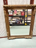 Full front view of mirror showing entire frame and glass