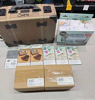 Overall lot showing Vagabond 2 machine, Sidekick kit, blister packs and sealed cartons