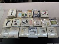 All boxed Tim Holtz Sizzix Bigz dies laid out on counter