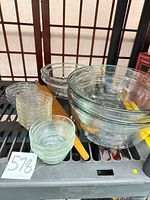 Mixing bowls, custard dishes, rolling pin grouped on shelf