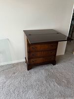 Chest with top leaf open showing fold-over design and drawers