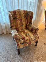 front view of floral upholstered wingback armchair