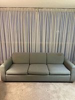 front view of three-seater couch