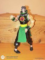 Front view of 9 inch action figure with green sash and kanji emblem