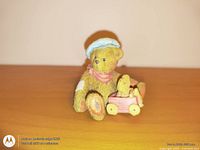 Front view of Cherished Teddys bear figurine with wagon