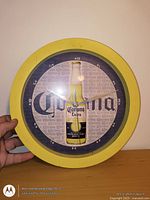 Front view of Corona Extra wall clock showing design and size reference