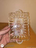 Top view of rectangular pressed glass dish showing pattern and handles