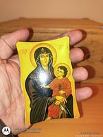 Front view of wooden icon plaque showing Madonna and Child image