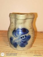 Front view of gray salt-glazed jug showing cobalt blue animal motif