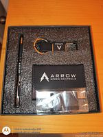 Top view of gift box showing pen, card holder, keychain in foam insert