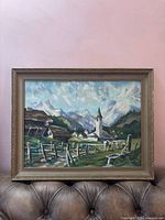 Framed painting on sofa showing full artwork and frame profile