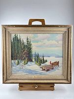 Framed winter landscape painting front view