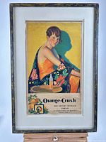 Full view of framed Orange Crush advertising poster