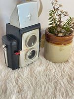 Camera next to prop for scale, illustrating overall look