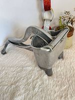 Overall view of cast aluminum food press showing basket, lever and base