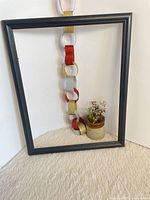 Full view of black frame standing vertically