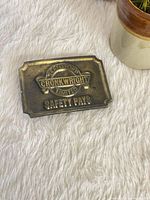 Front view showing full embossed design and text