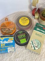 Group shot of all five items including four line spools and sinker selector