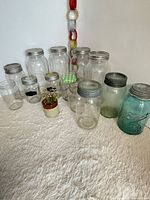 Group shot of 13 jars showing variety of sizes, shapes and lids
