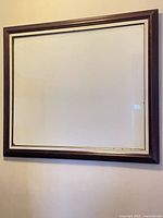 Full view of wooden picture frame on wall