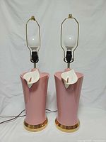 Front view of both pink ceramic lamps without shades