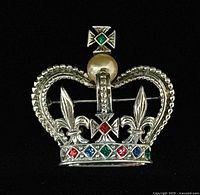 Front view showing crown design, rhinestones and pearl