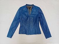Front view of blue leather jacket showing overall design