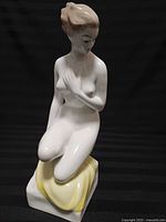 Front three-quarter view of porcelain figurine