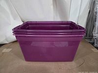 Three nested purple Sterilite totes perspective view
