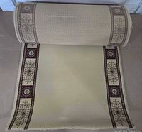 Runner partially unrolled showing pattern and width