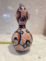 Front view of double-gourd porcelain vase showing Imari-style decoration