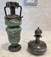 Ewer and perfume bottle upright showing overlay and patina