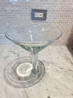 Full view of oversized martini glass on countertop