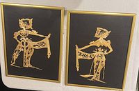 Front view of both framed Balinese dancer panels showing artwork and frames