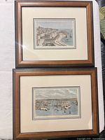 Two framed Malta harbor engravings side by side