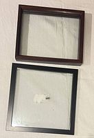 Front view of both frames on fabric background