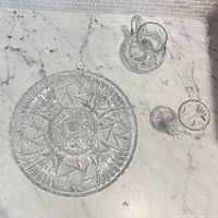 Platter, pitcher and bud vase on countertop
