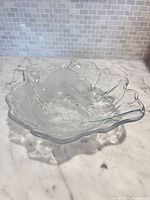 Top view of clear crystal bowl showing scalloped rim and frosted floral etching